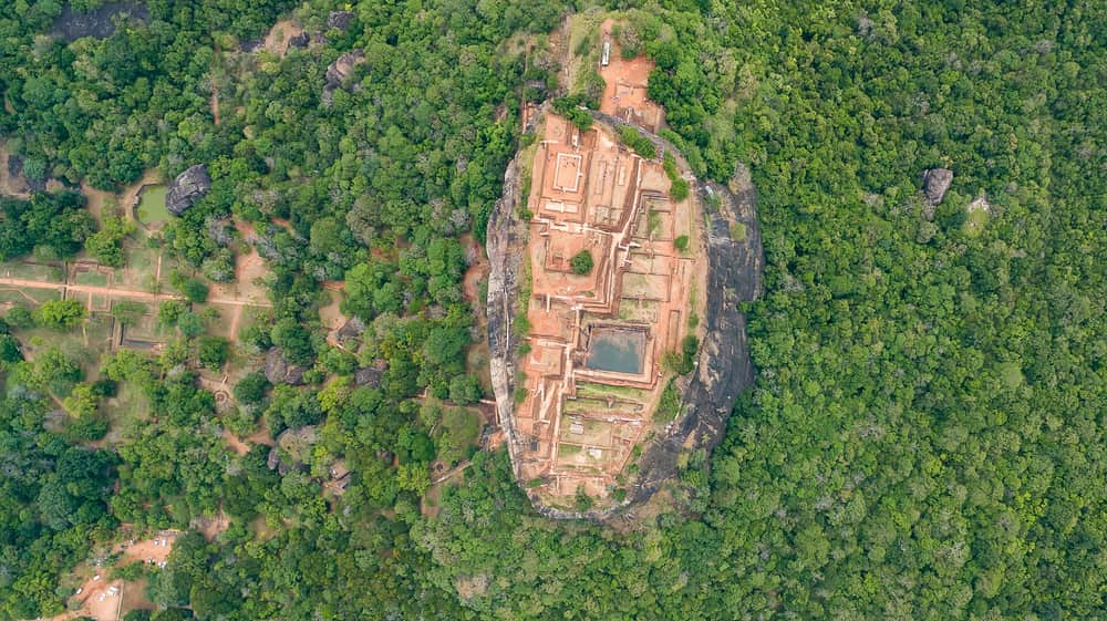 Aerial view of the Sigiriya rock fortress surrounded by forest